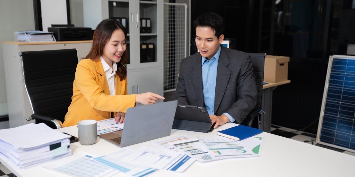 Business corporate team brainstorming, planning strategy having a discussion Analysis investment researching with chart at office desk documents in office.